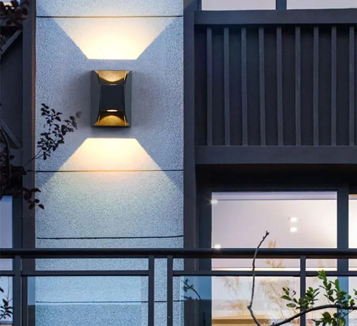 Outdoor wall light over a terrace and pool area.
