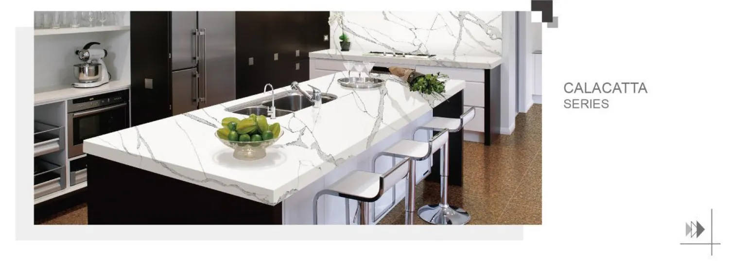 White quartz island with fine veining and an integrated sink.