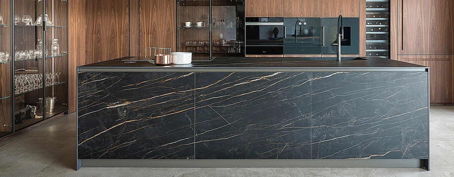 Black slab with gold veining for fronts and worktops.